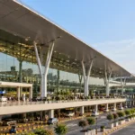 Exterior architecture of Rajiv Gandhi International Airport passenger terminal in Hyderabad, India.