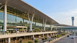 Exterior architecture of Rajiv Gandhi International Airport passenger terminal in Hyderabad, India.